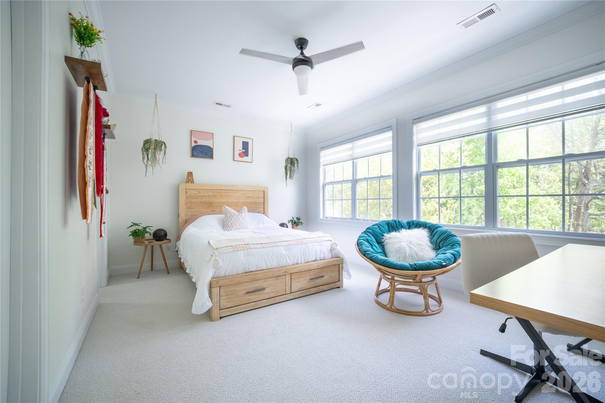 12058 Pelican Court Tega Cay, SC 29708 - Photo 20 of 43 a spacious bedroom with a bed and a large window