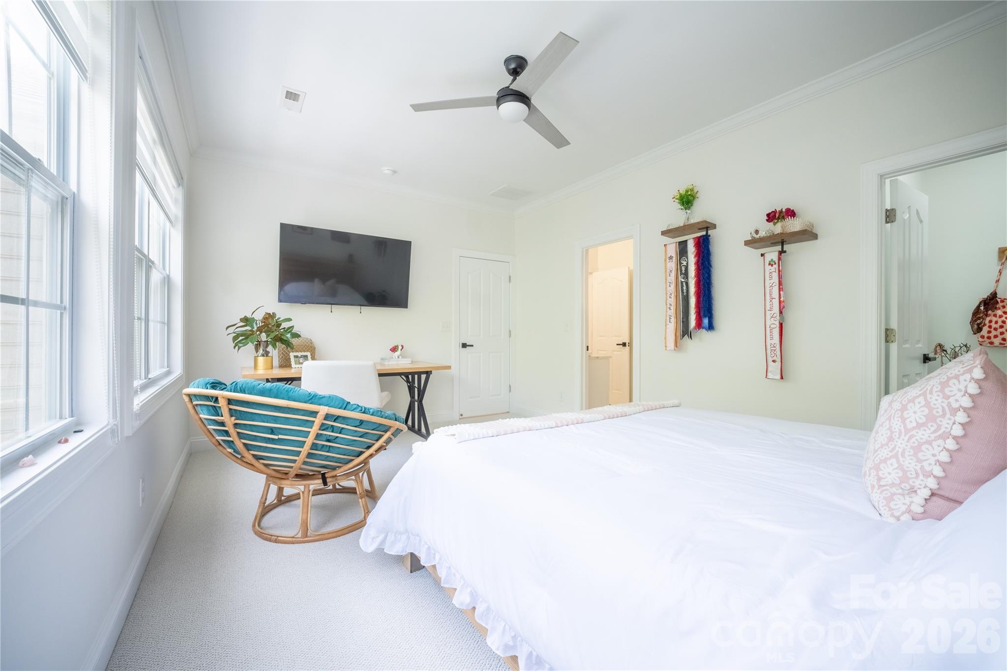 12058 Pelican Court Tega Cay, SC 29708 - Photo 21 of 43 a bedroom with furniture and a flat screen tv