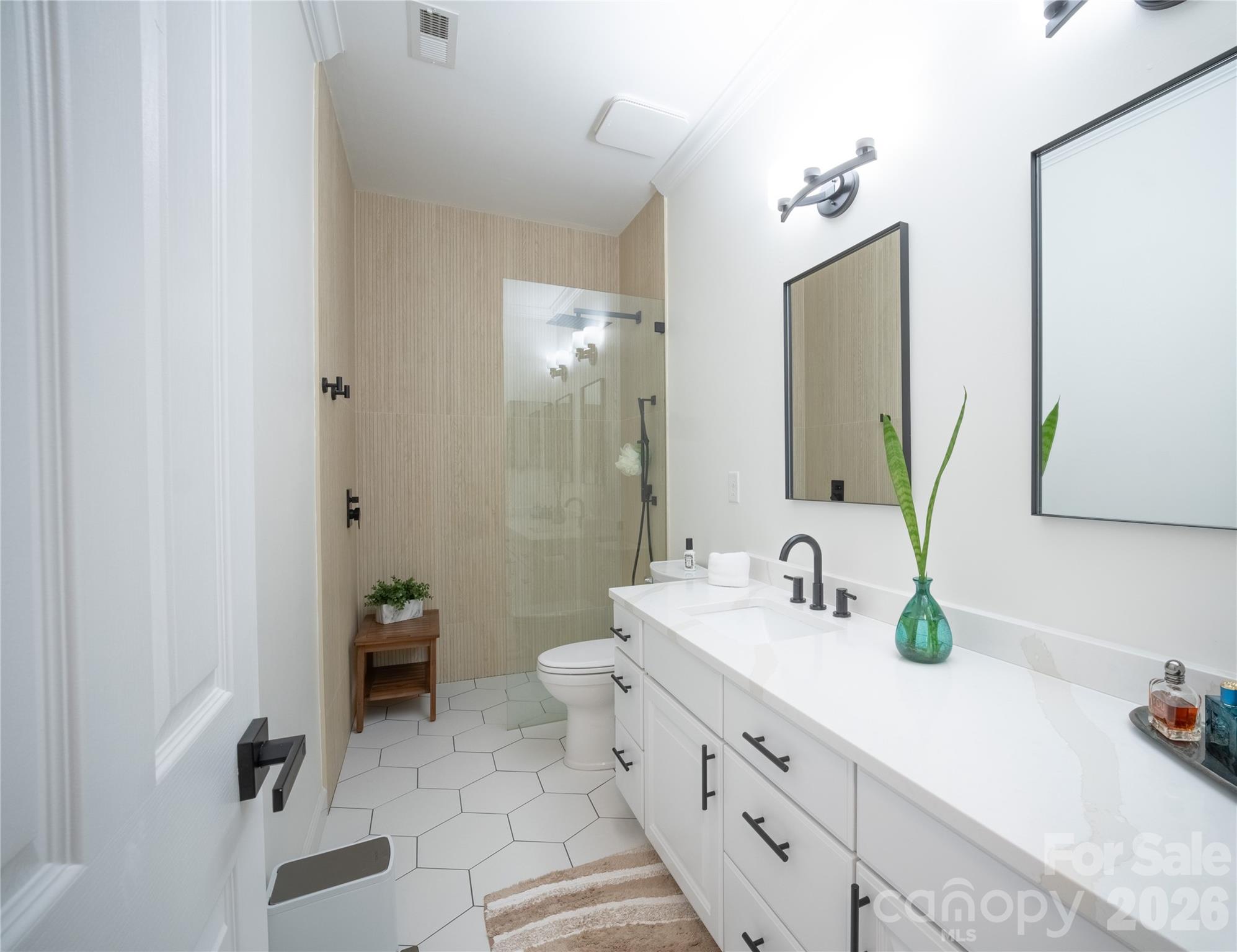 12058 Pelican Court Tega Cay, SC 29708 - Photo 25 of 43 a spacious bathroom with double vanity and a mirror