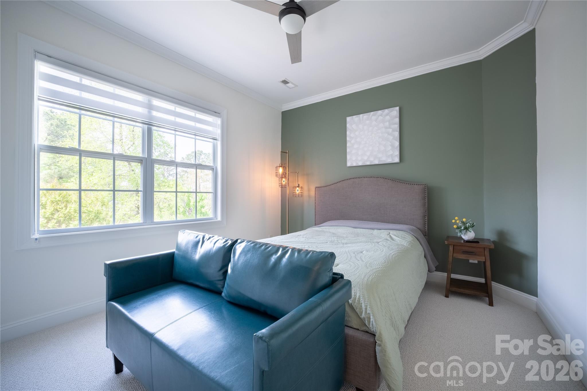 12058 Pelican Court Tega Cay, SC 29708 - Photo 30 of 43 a bedroom with a bed and window