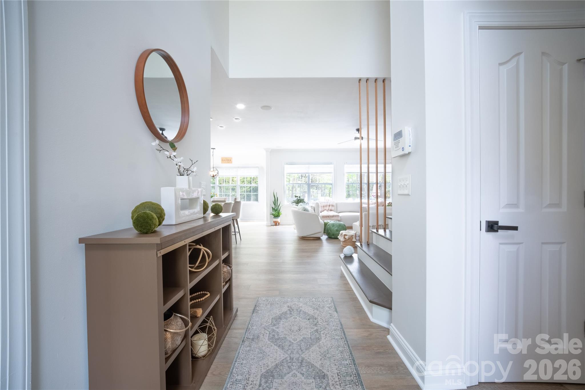 12058 Pelican Court Tega Cay, SC 29708 - Photo 3 of 43 a view of living room with furniture and floor to ceiling window