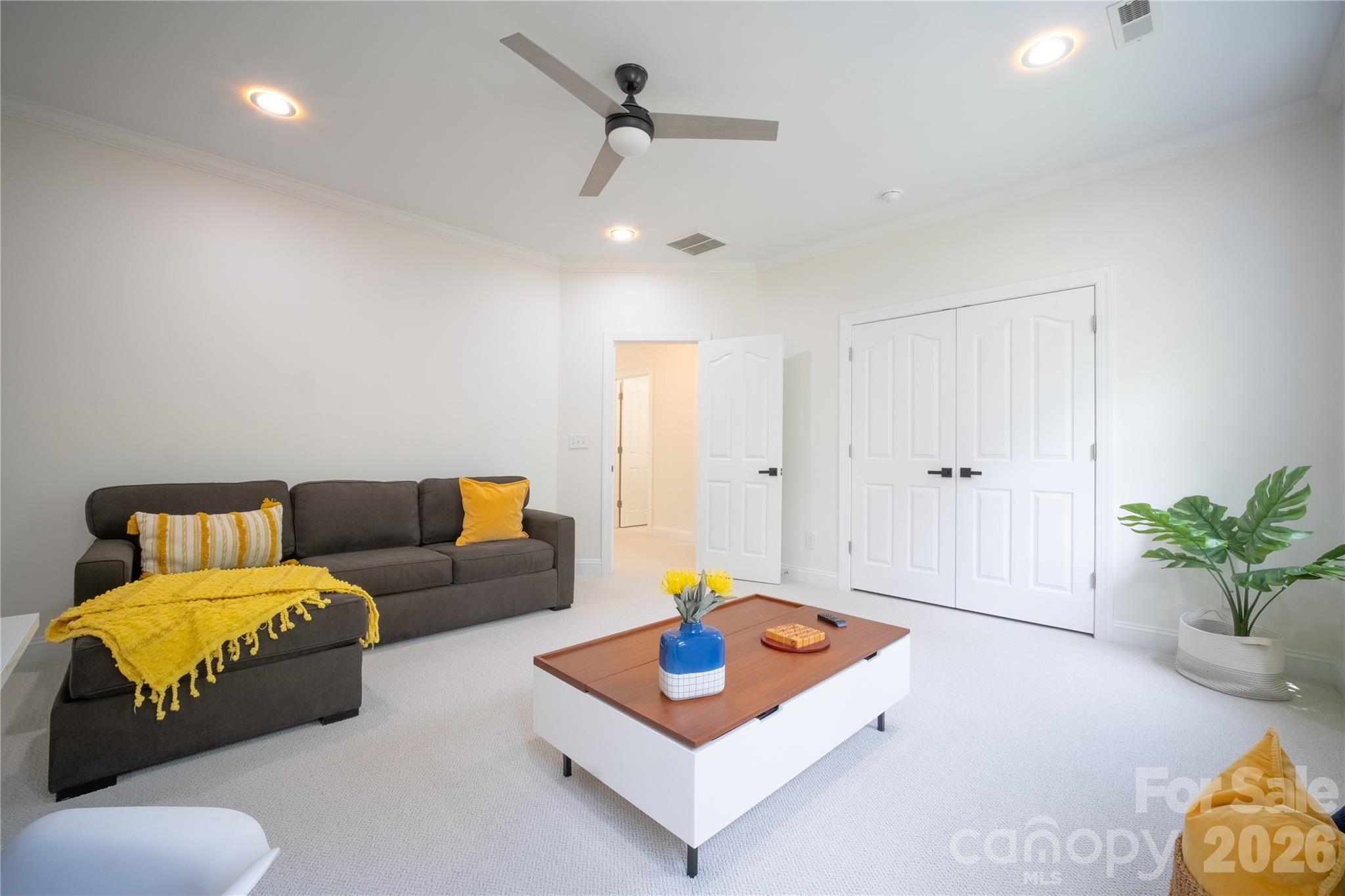 12058 Pelican Court Tega Cay, SC 29708 - Photo 32 of 43 a living room with furniture and wooden floor