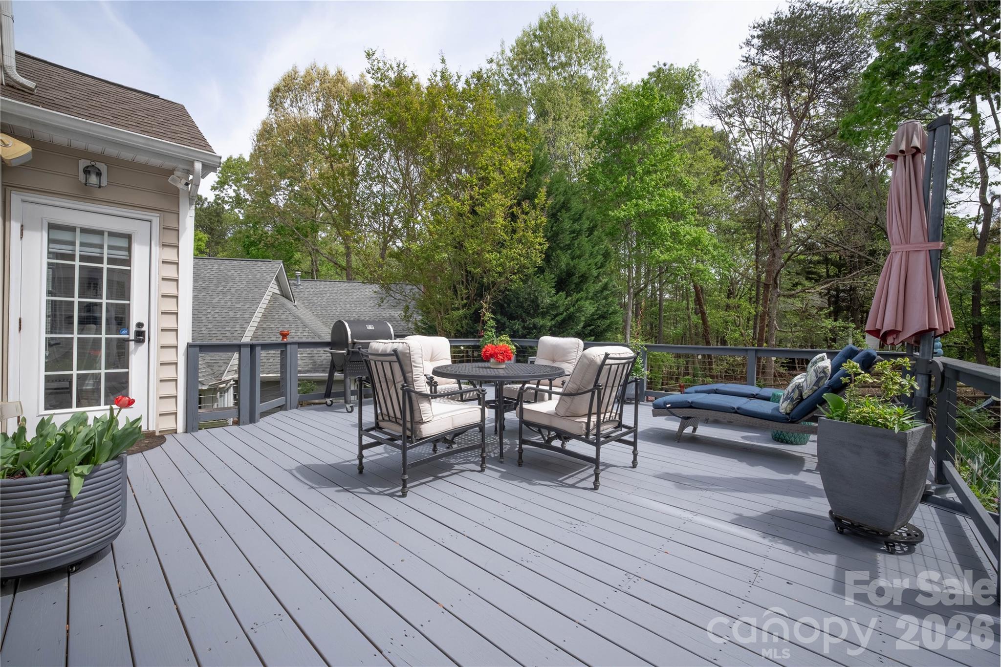 12058 Pelican Court Tega Cay, SC 29708 - Photo 35 of 43 a view of a patio with wooden floor and outdoor seating