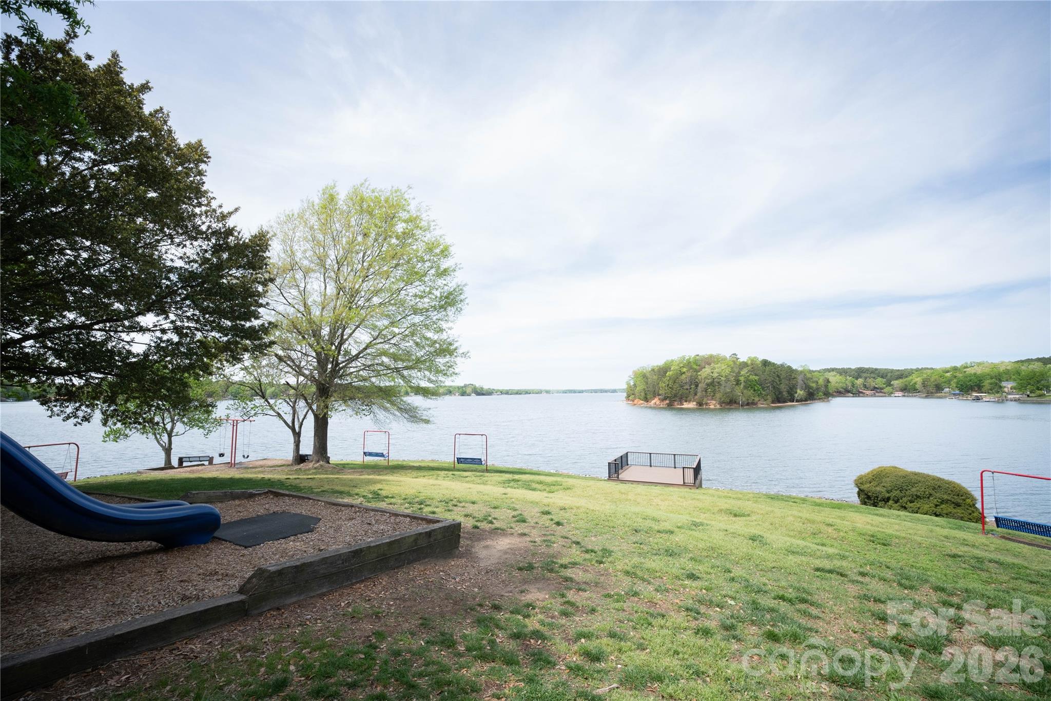12058 Pelican Court Tega Cay, SC 29708 - Photo 43 of 43 a view of a lake with a yard