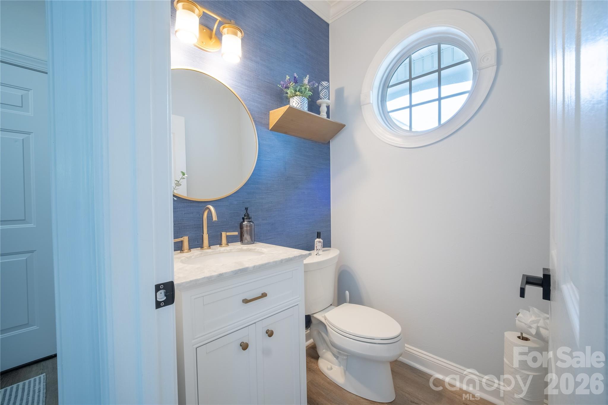 12058 Pelican Court Tega Cay, SC 29708 - Photo 7 of 43 a bathroom with a sink mirror and toilet