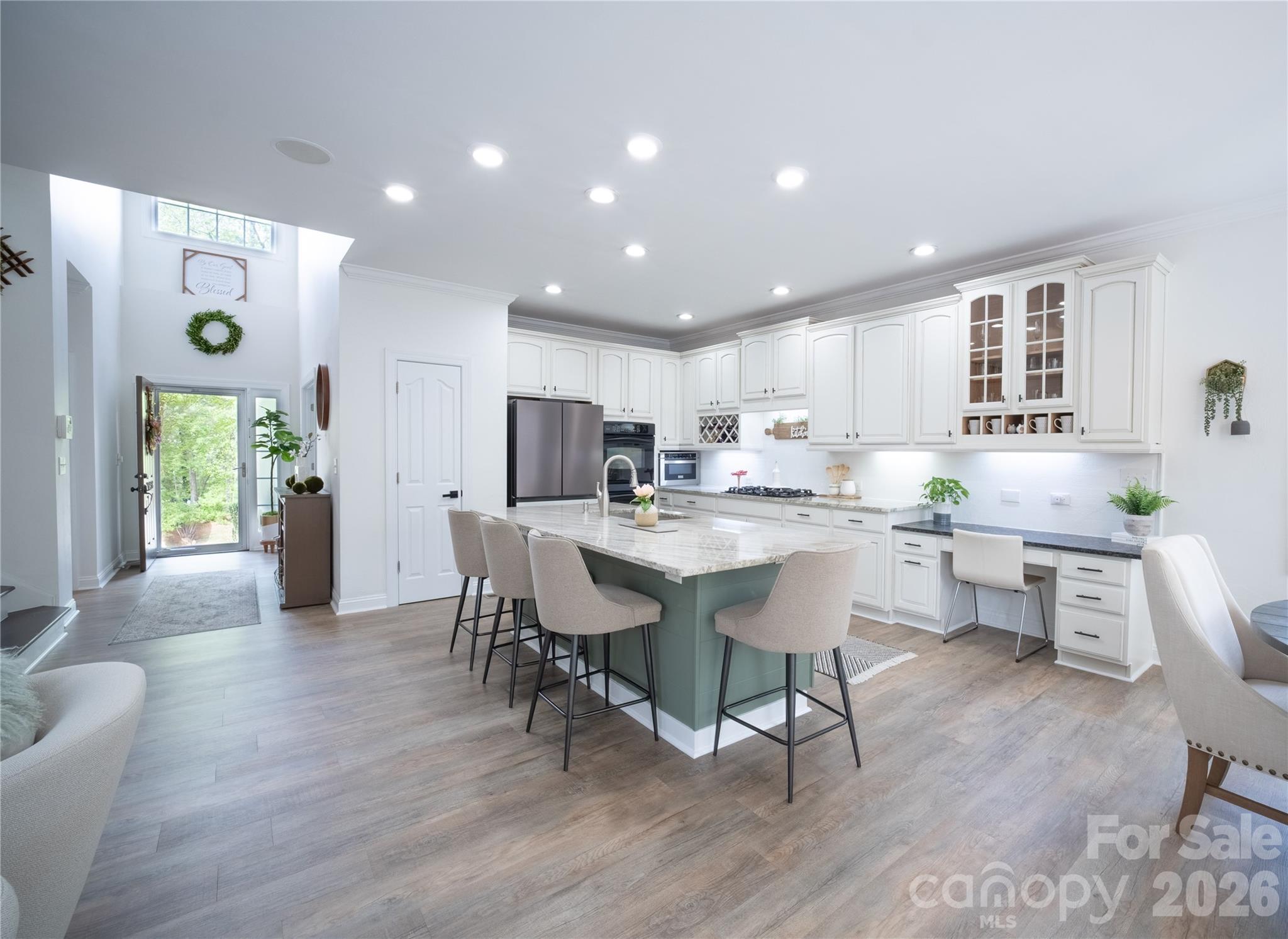 12058 Pelican Court Tega Cay, SC 29708 - Photo 8 of 43 a living room with stainless steel appliances kitchen island granite countertop furniture and a wooden floor