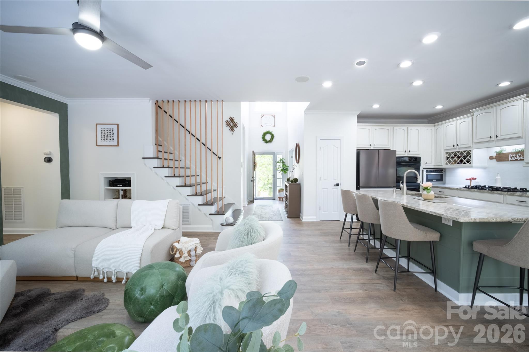 12058 Pelican Court Tega Cay, SC 29708 - Photo 9 of 43 a living room with furniture kitchen and a dining table