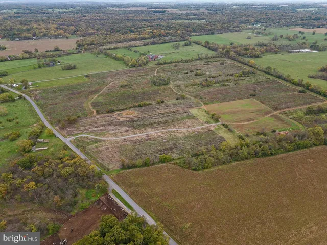 a view of a field with an ocean view