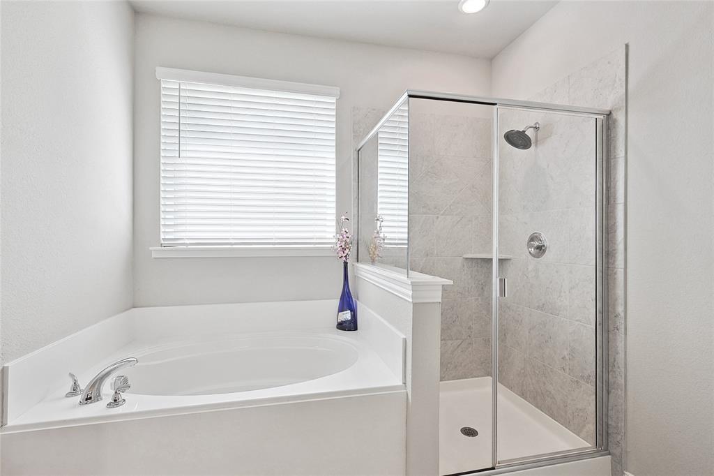 808 Feather Edge Drive Springtown, TX 76082 - Photo 26 of 40 a white bath tub sitting next to a shower