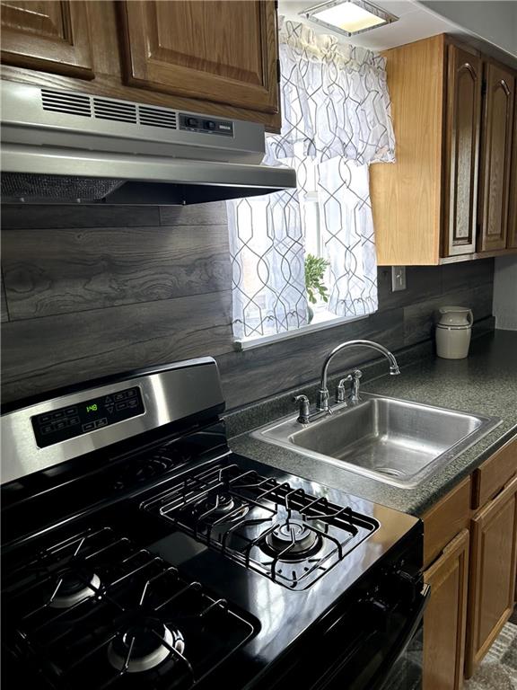 512 Lowell Street Vandergrift, PA 15690 - Photo 14 of 32 a kitchen with a stove and a sink
