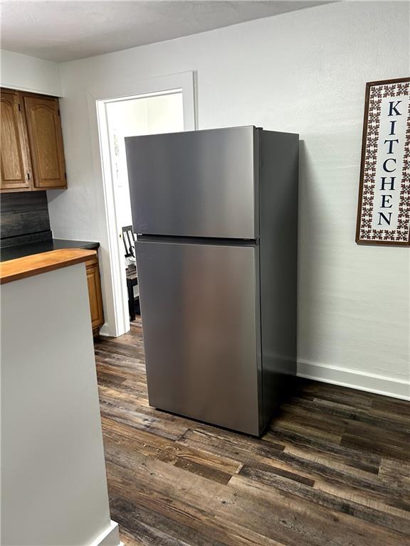 512 Lowell Street Vandergrift, PA 15690 - Photo 16 of 32 a view of a kitchen with wooden floor and a refrigerator