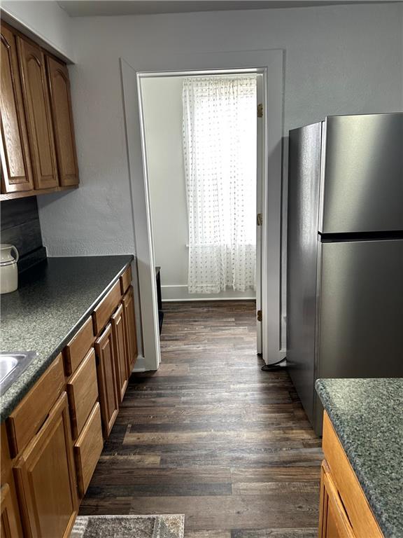 512 Lowell Street Vandergrift, PA 15690 - Photo 17 of 32 a kitchen with stainless steel appliances granite countertop a refrigerator a stove and a sink