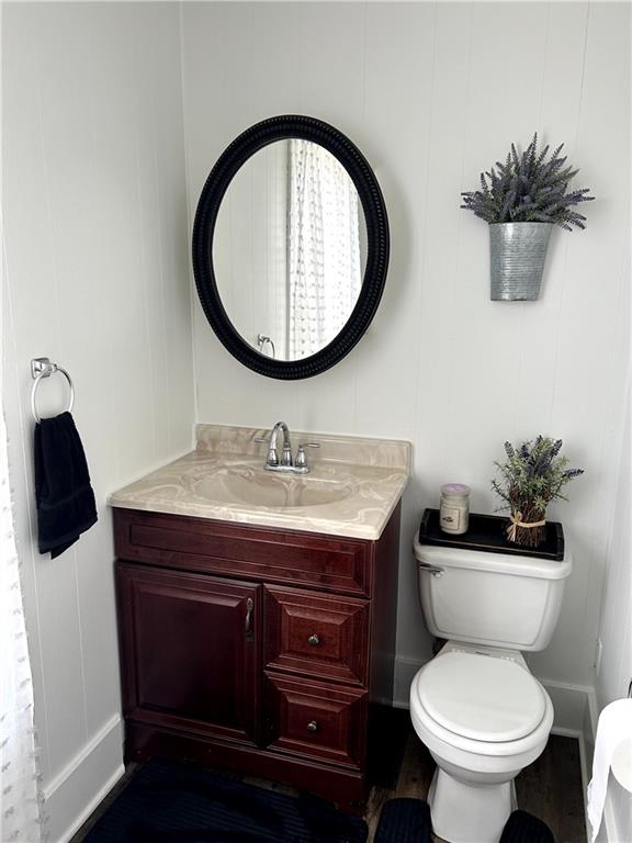 512 Lowell Street Vandergrift, PA 15690 - Photo 19 of 32 a bathroom with a toilet a sink and a mirror