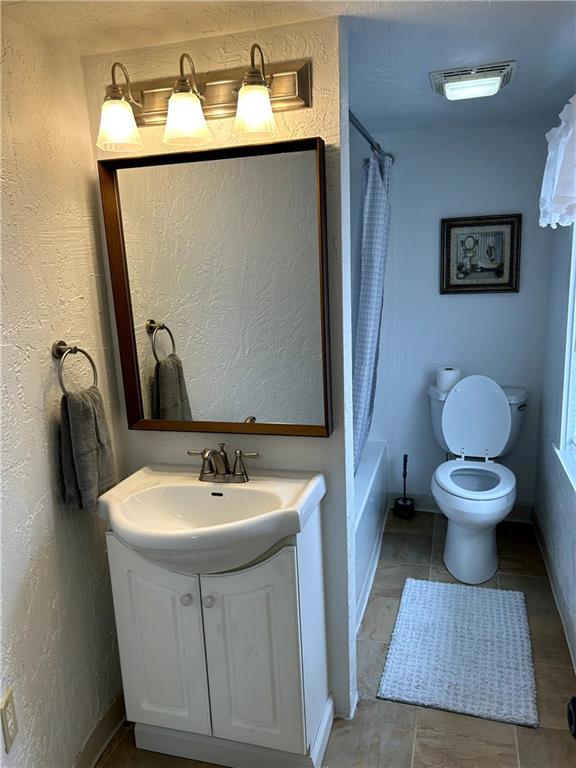 512 Lowell Street Vandergrift, PA 15690 - Photo 23 of 32 a bathroom with a sink toilet and mirror