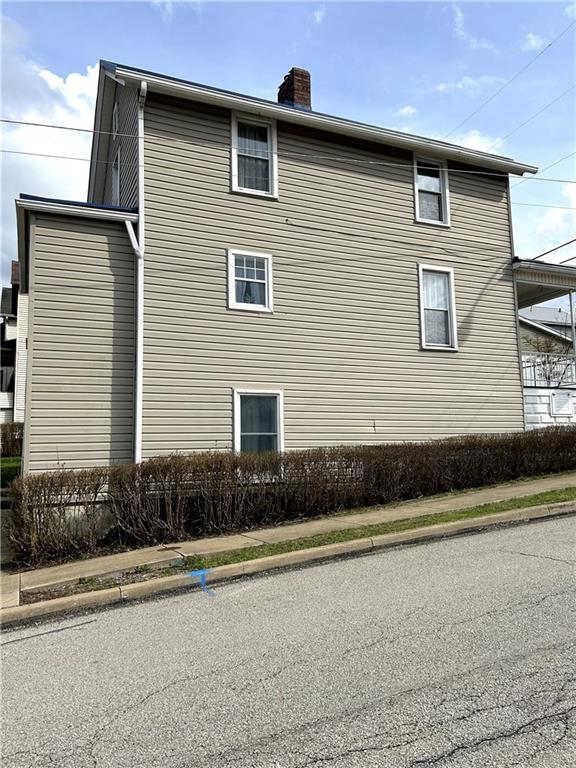 512 Lowell Street Vandergrift, PA 15690 - Photo 3 of 32 a front view of a house with a yard