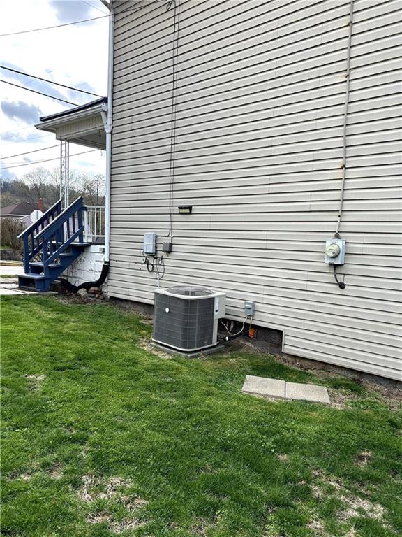 512 Lowell Street Vandergrift, PA 15690 - Photo 7 of 32 a view of a house with a backyard