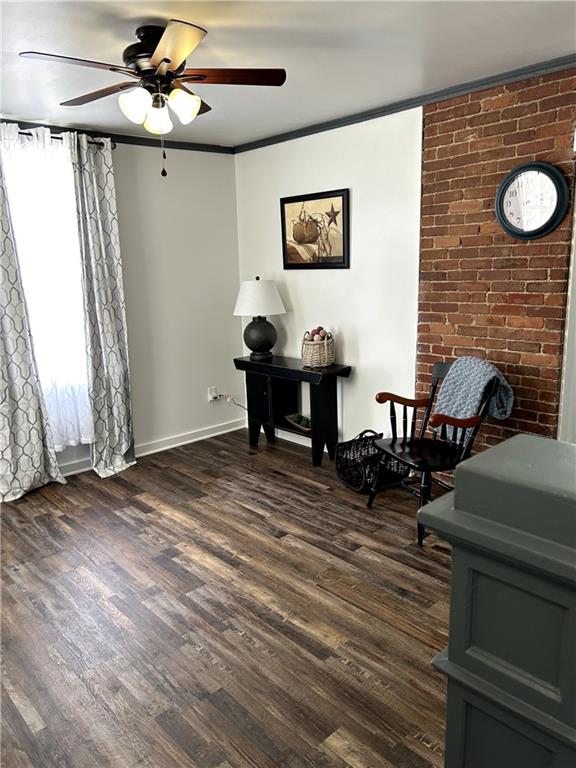 512 Lowell Street Vandergrift, PA 15690 - Photo 8 of 32 a view of a livingroom with furniture and a ceiling fan