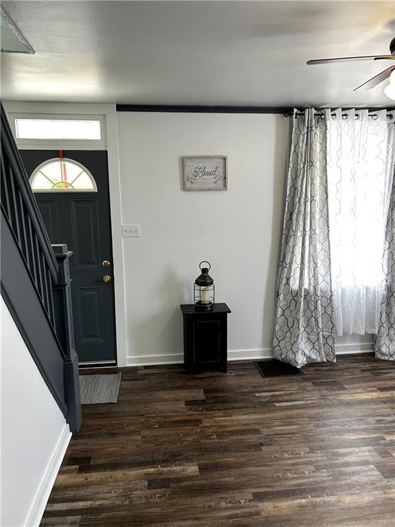 512 Lowell Street Vandergrift, PA 15690 - Photo 9 of 32 a view of a livingroom with wooden floor and stairs