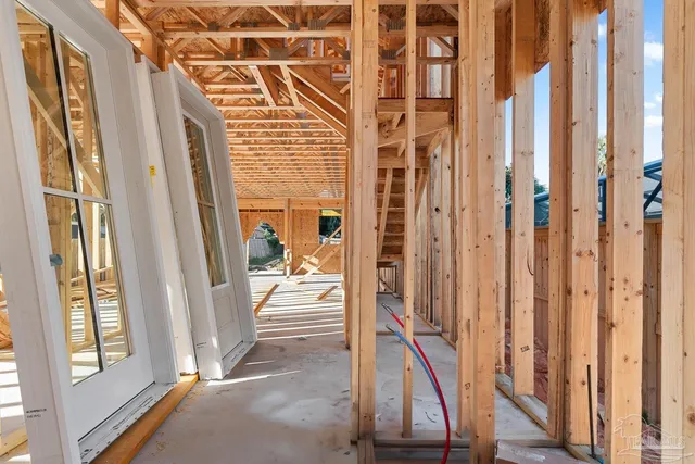 a view of a balcony with wooden floor and stairs