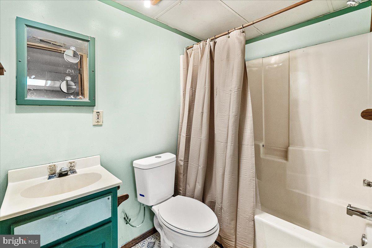 9101 Bessie Clemson Road Union Bridge, MD 21791 - Photo 28 of 55 a white toilet sitting next to a bathroom sink