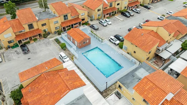 an aerial view of a house with a lake view