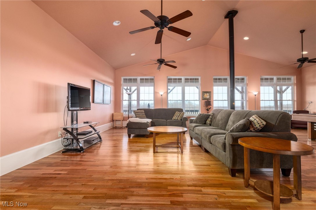 35955-35959 Bower Road Scio, OH 43988 - Photo 8 of 50 Living room with a wealth of natural light, light wood-type flooring, and ceiling fan