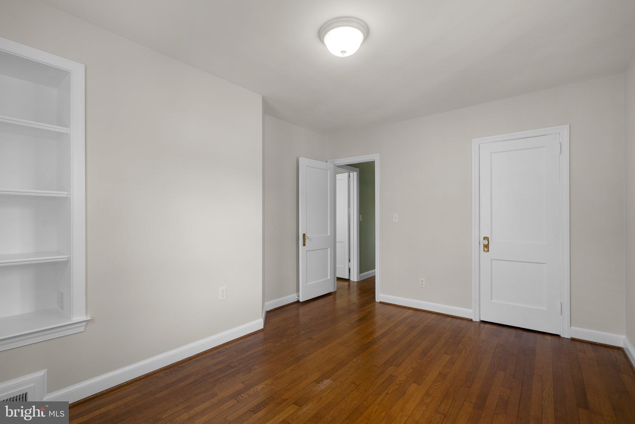 10210 Pierce Drive Silver Spring, MD 20901 - Photo 17 of 49 a view of an empty room with wooden floor