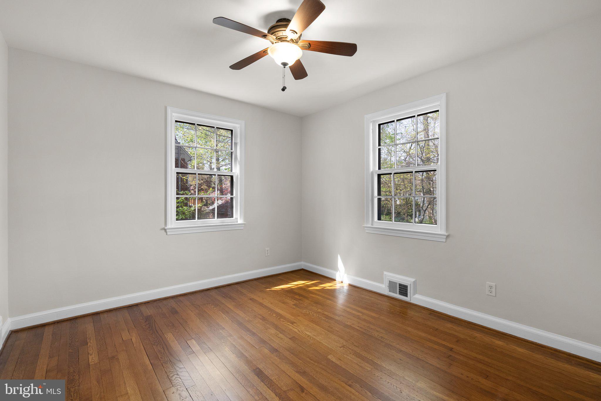 10210 Pierce Drive Silver Spring, MD 20901 - Photo 19 of 49 a view of a room with wooden floor and windows