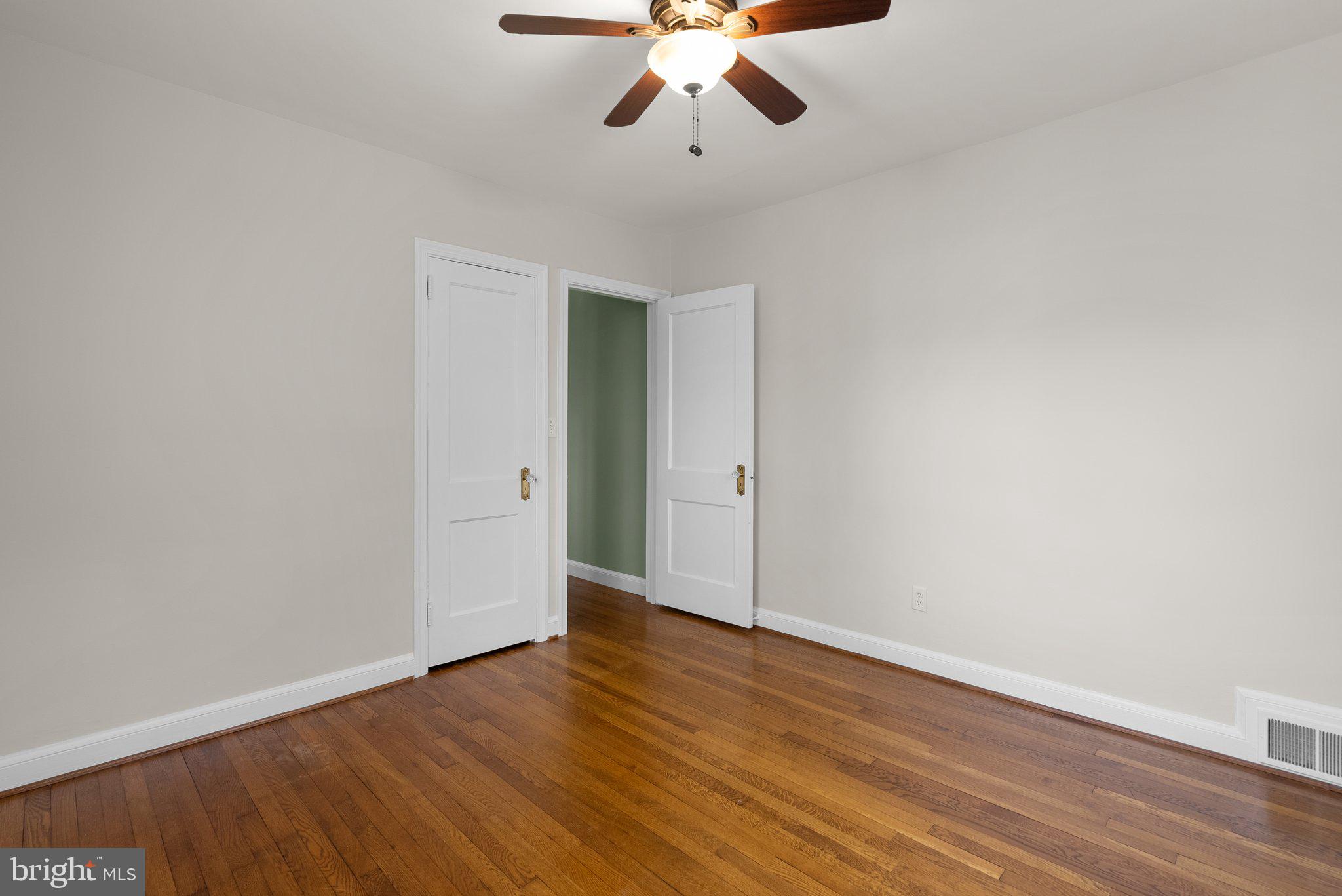 10210 Pierce Drive Silver Spring, MD 20901 - Photo 20 of 49 a view of an empty room with wooden floor