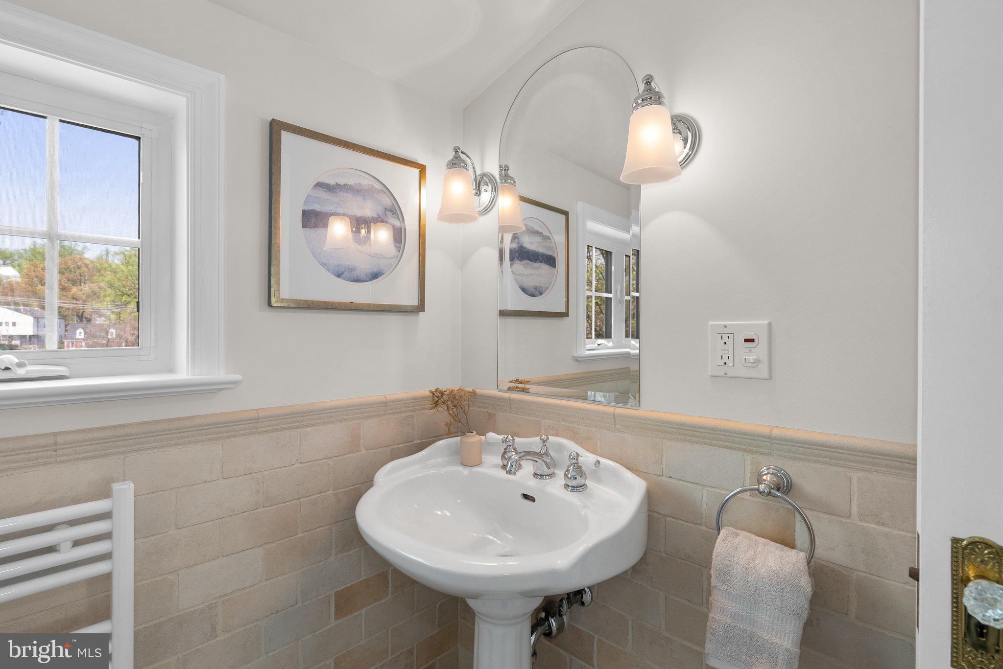 10210 Pierce Drive Silver Spring, MD 20901 - Photo 28 of 49 a bathroom with a sink and a mirror