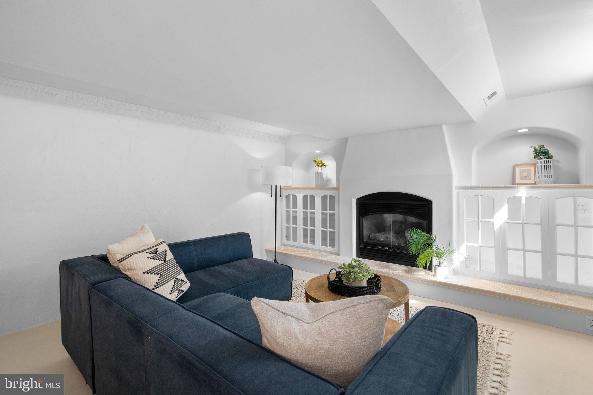 10210 Pierce Drive Silver Spring, MD 20901 - Photo 30 of 49 a living room with furniture and a fireplace