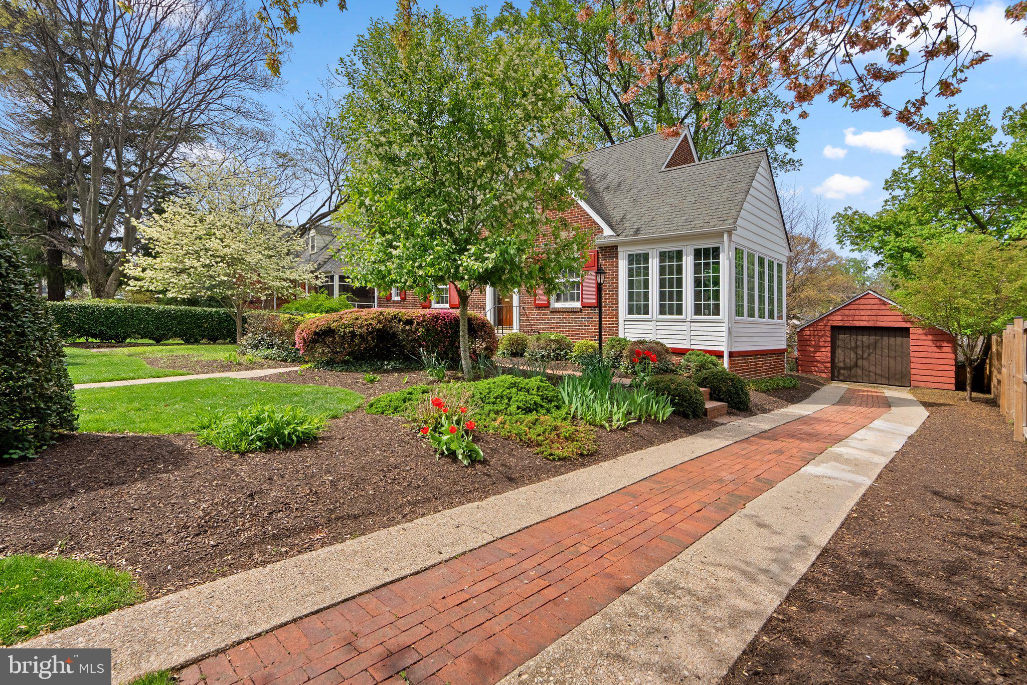 10210 Pierce Drive Silver Spring, MD 20901 - Photo 3 of 49 a front view of a house with a garden and plants
