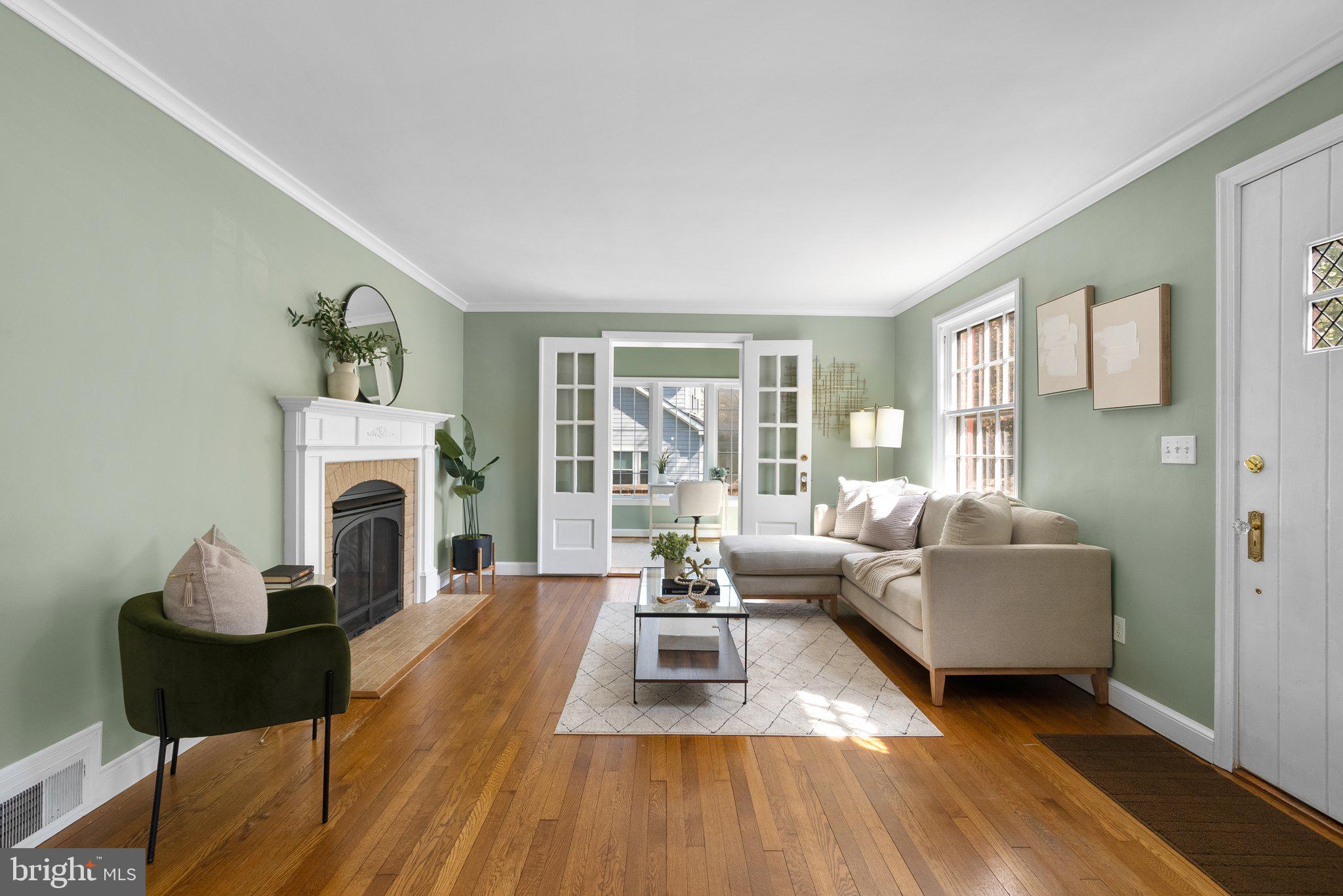 10210 Pierce Drive Silver Spring, MD 20901 - Photo 5 of 49 a living room with furniture a fireplace and a table