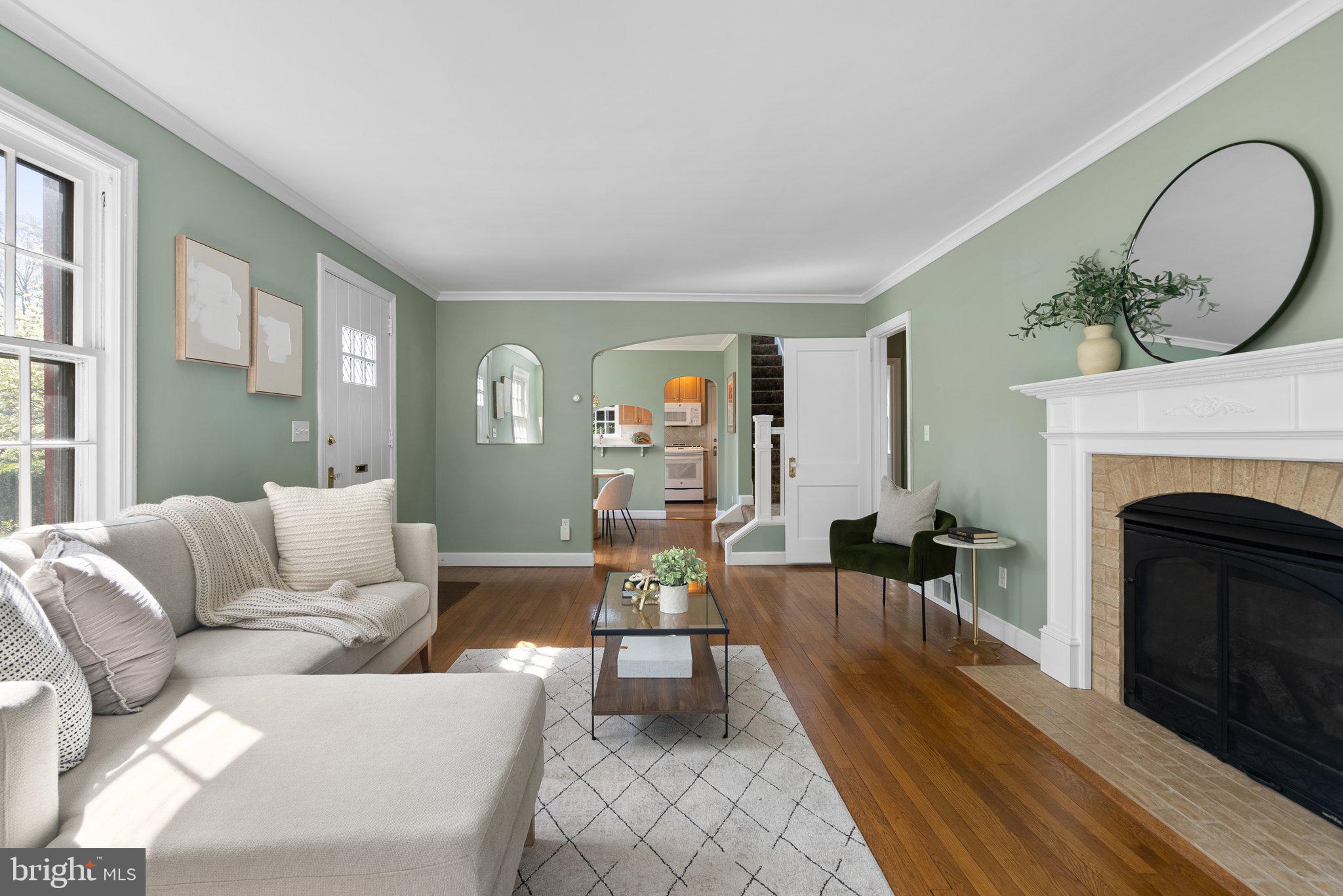 10210 Pierce Drive Silver Spring, MD 20901 - Photo 8 of 49 a living room with furniture and a fireplace