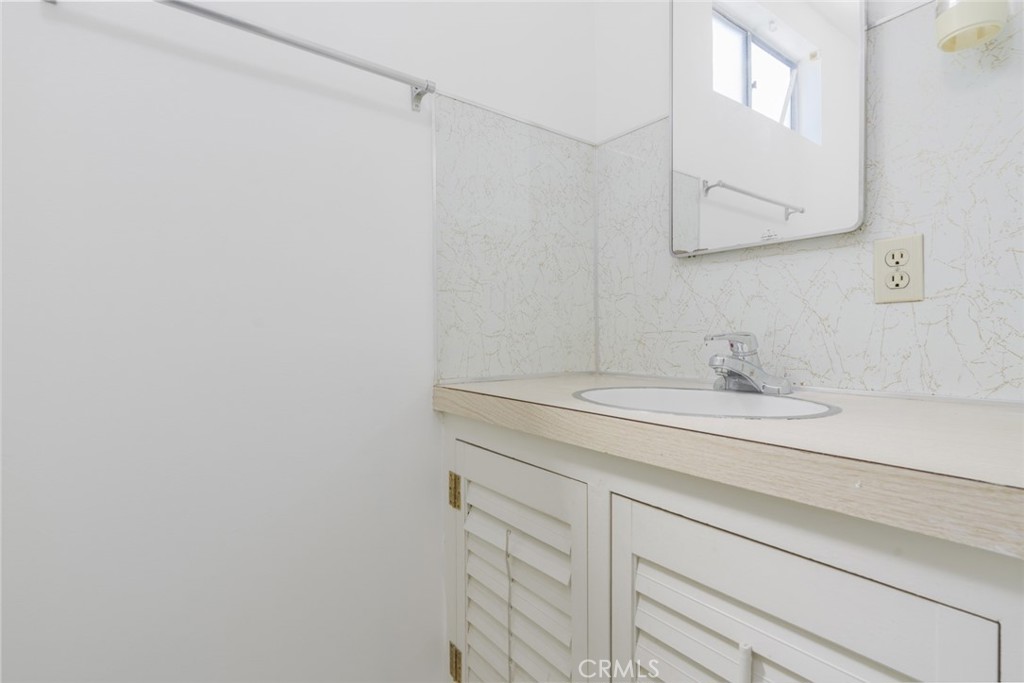 13792 Figueroa Street Garden Grove, CA 92843 - Photo 11 of 38 a bathroom with a sink and a mirror