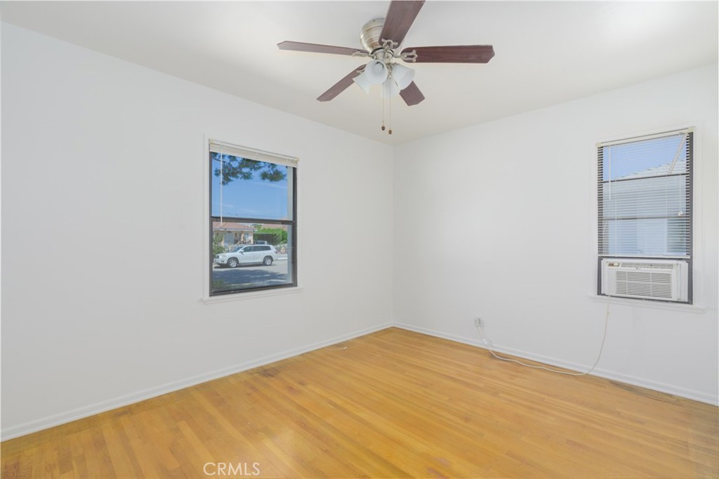 13792 Figueroa Street Garden Grove, CA 92843 - Photo 19 of 38 an empty room with a window and ceiling fan
