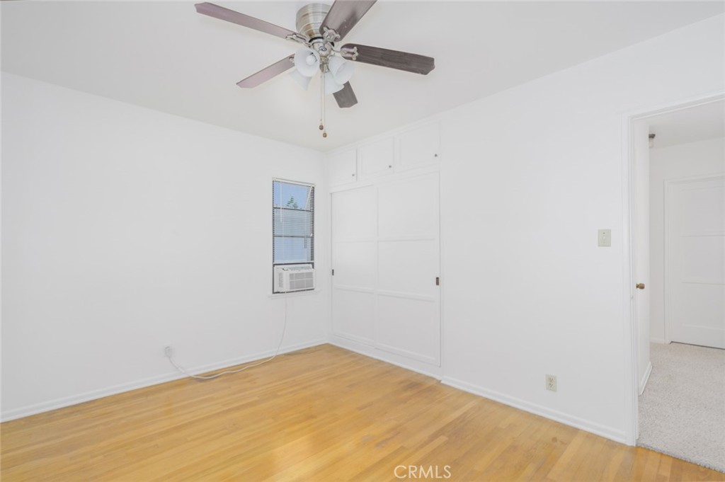 13792 Figueroa Street Garden Grove, CA 92843 - Photo 20 of 38 an empty room with a window and a fan