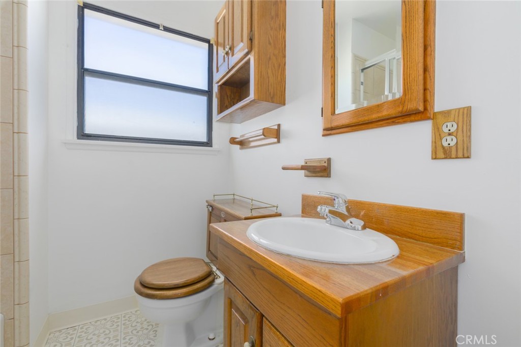 13792 Figueroa Street Garden Grove, CA 92843 - Photo 23 of 38 a bathroom with a sink and a toilet