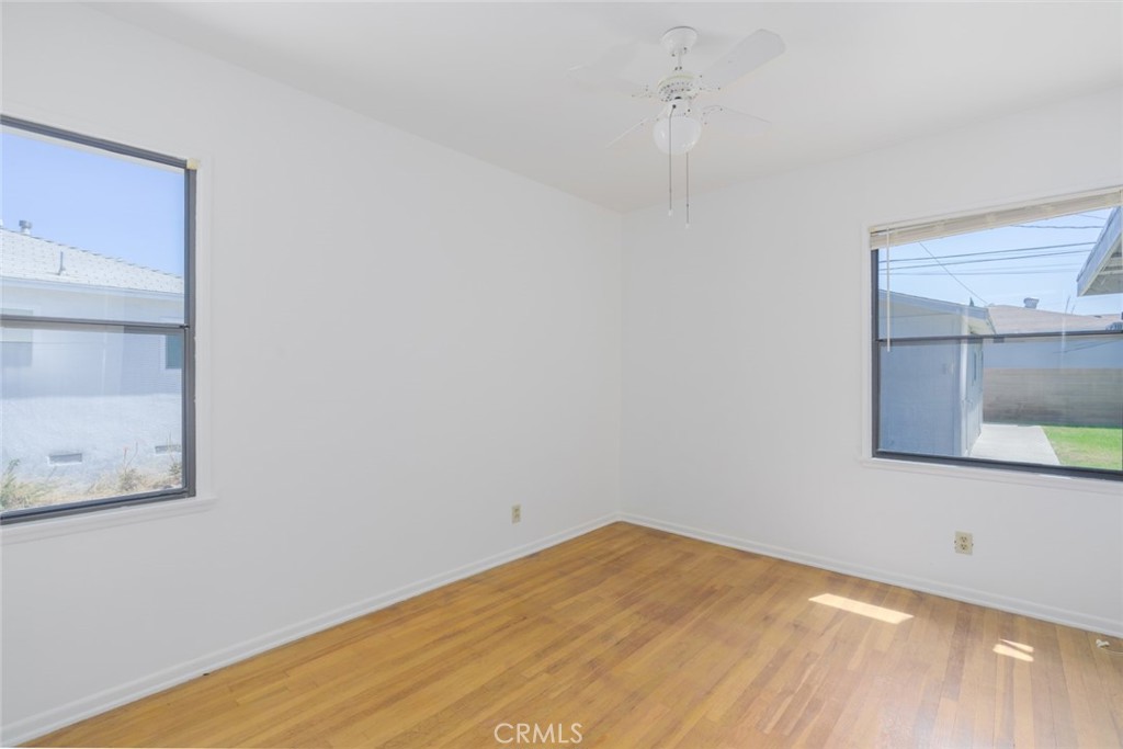 13792 Figueroa Street Garden Grove, CA 92843 - Photo 24 of 38 a view of empty room with wooden floor and fan