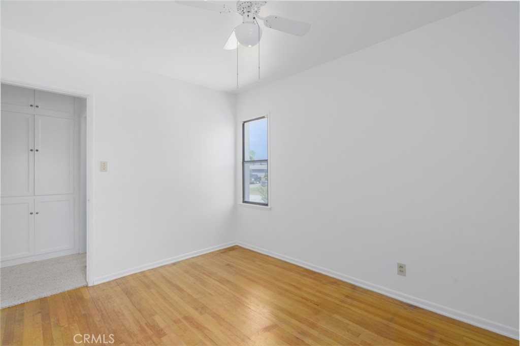 13792 Figueroa Street Garden Grove, CA 92843 - Photo 27 of 38 an empty room with wooden floor and windows