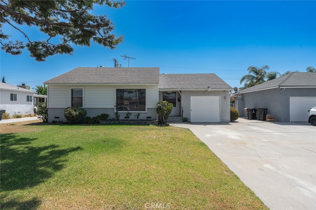 13792 Figueroa Street Garden Grove, CA 92843 - Photo 37 of 38 a front view of a house with a garden