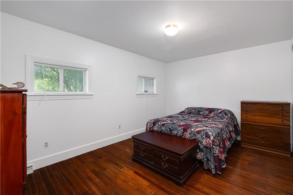 411 Harmony Road Baden, PA 15005 - Photo 15 of 25 a bedroom with a bed and a dresser