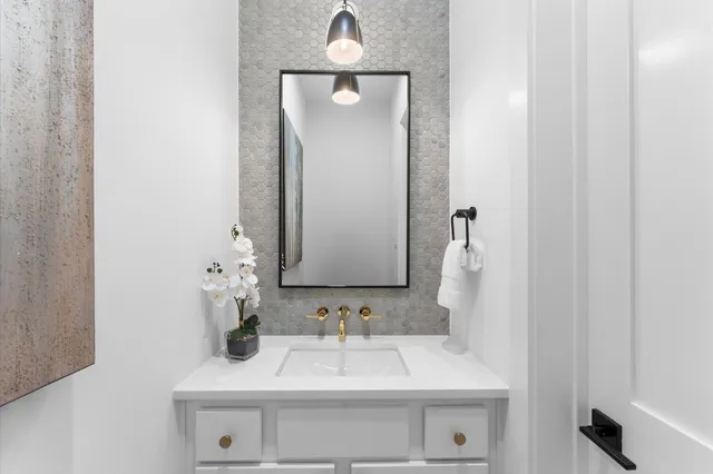 a living room with fireplace furniture and a large window