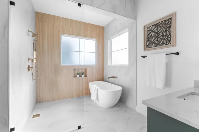a bathroom with a bathtub and window
