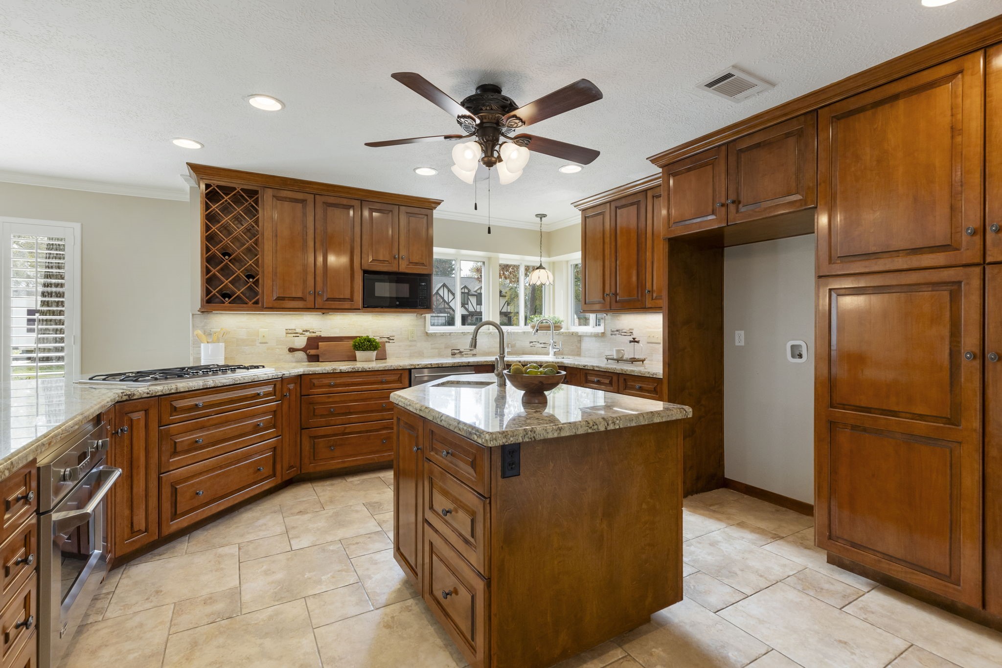6414 Hickorycrest Drive Spring, TX 77389 - Photo 11 of 49 a kitchen with stainless steel appliances granite countertop a sink stove and refrigerator
