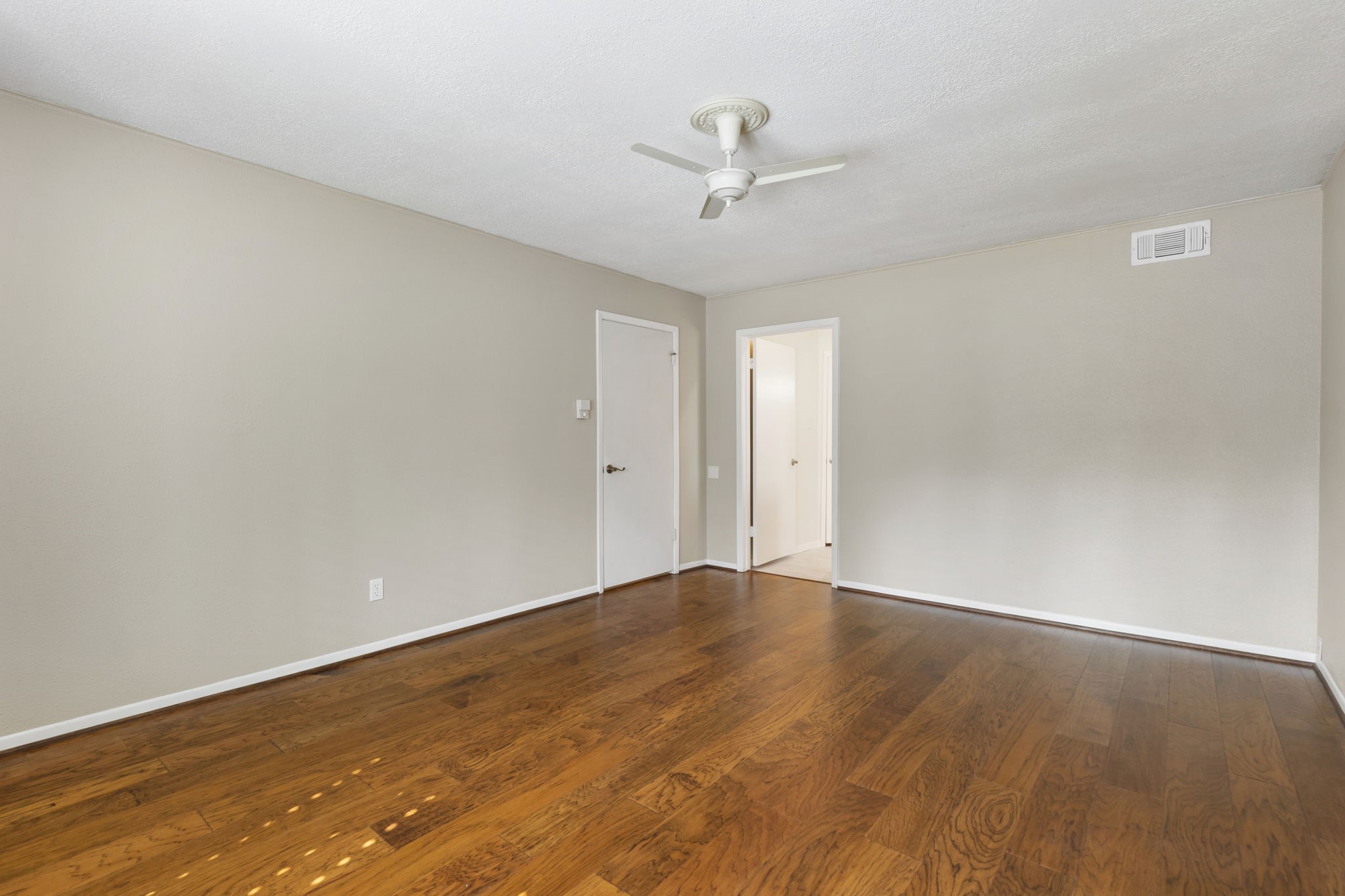 6414 Hickorycrest Drive Spring, TX 77389 - Photo 21 of 49 a view of an empty room with a chandelier fan