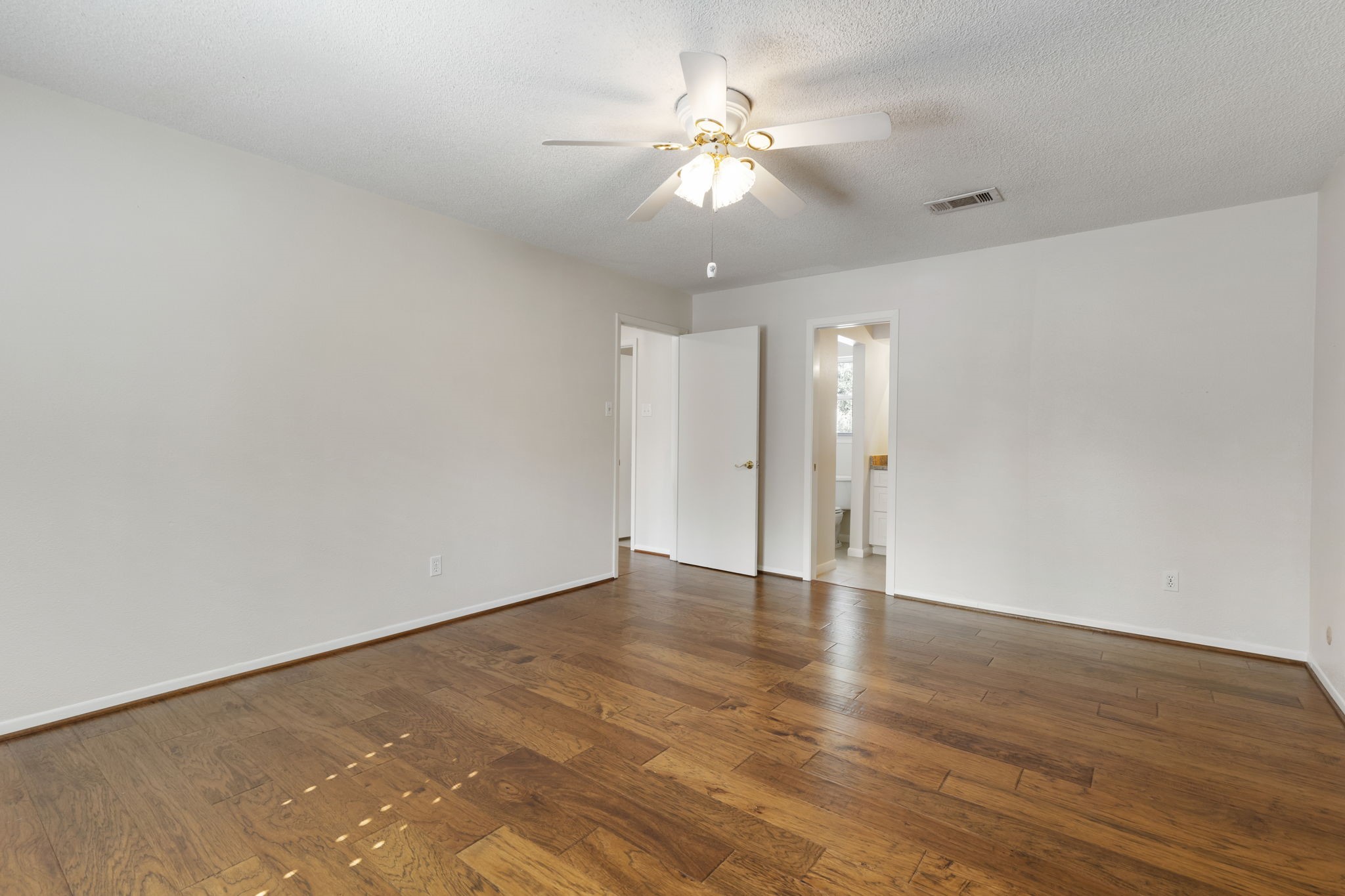 6414 Hickorycrest Drive Spring, TX 77389 - Photo 27 of 49 a view of an empty room with wooden floor