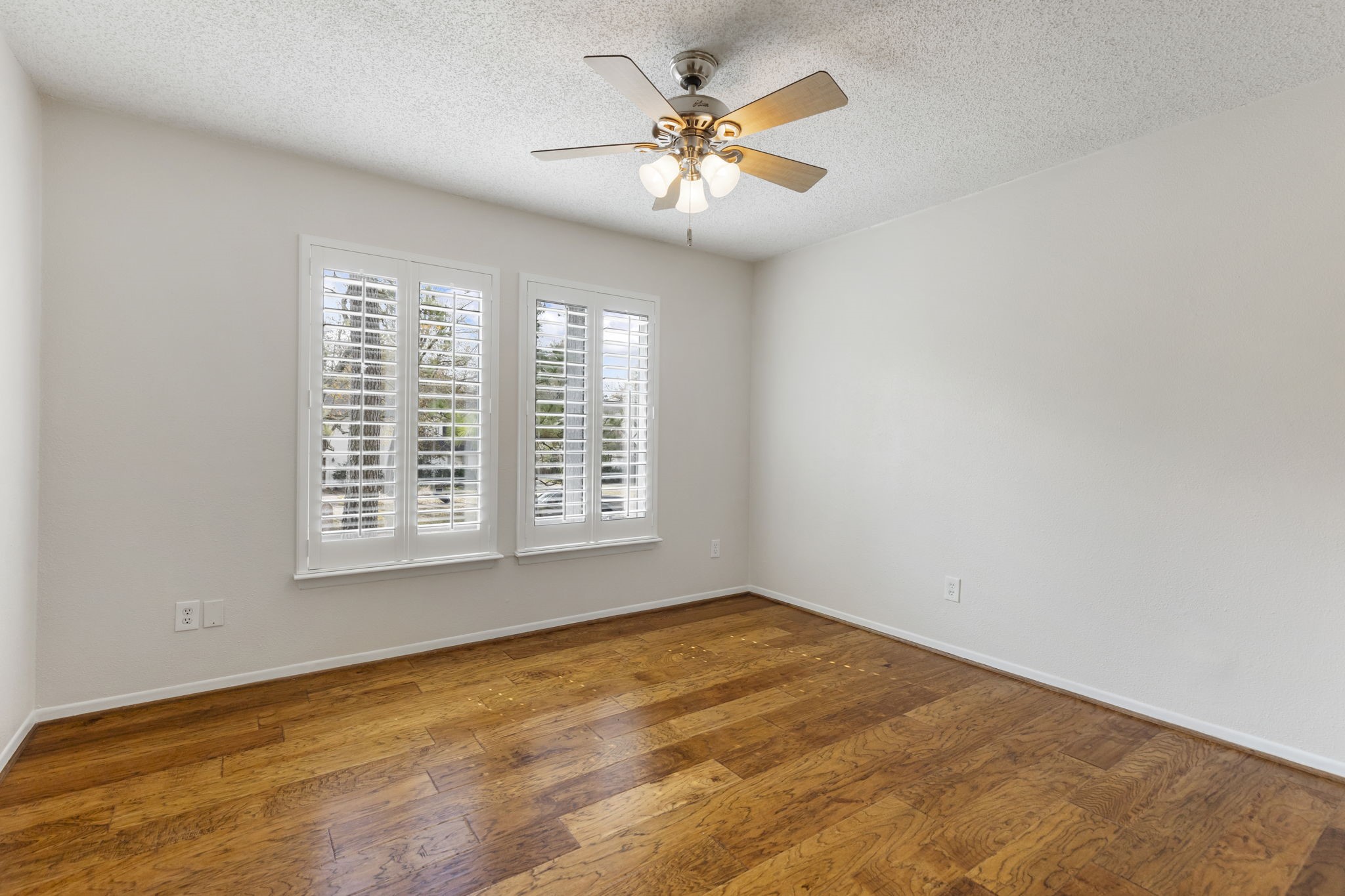 6414 Hickorycrest Drive Spring, TX 77389 - Photo 28 of 49 an empty room with a window and a fan