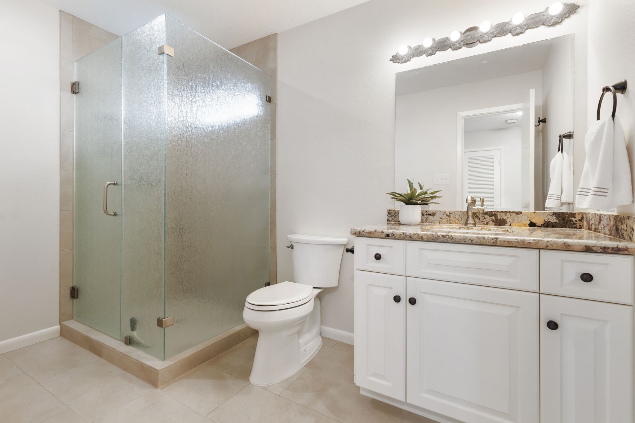 6414 Hickorycrest Drive Spring, TX 77389 - Photo 29 of 49 a bathroom with a shower sink vanity and mirror