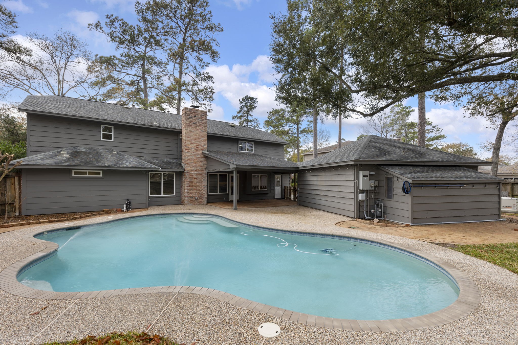 6414 Hickorycrest Drive Spring, TX 77389 - Photo 36 of 49 a view of a house with pool and a yard
